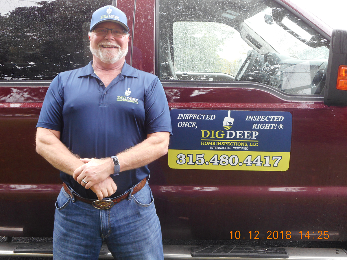 Contractor in front of pickup truck